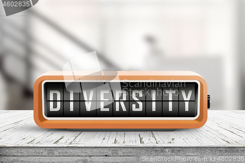 Image of Diversity word on a retro device on a wooden table