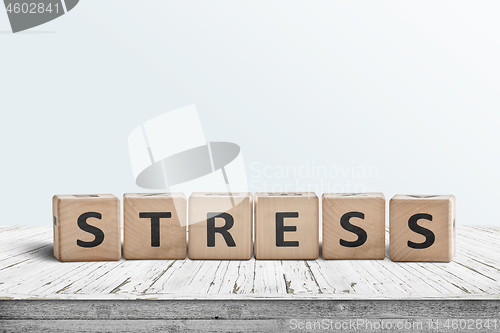 Image of The word stress on a sign made of wooden blocks