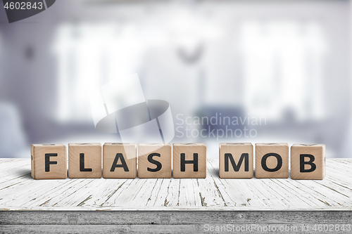 Image of Flash mob message sign on a table in a bright room