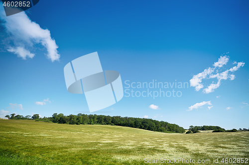 Image of Rural landscape with fields under a blue sky