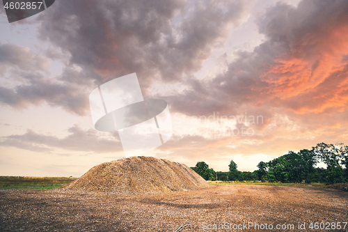 Image of Mulch pile in the summer sunset