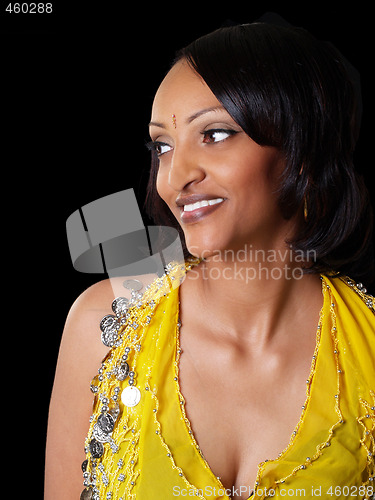Image of Young black woman looking off portrait yellow top