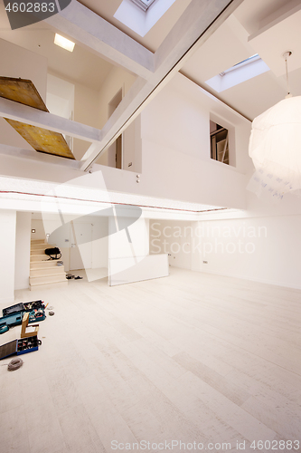 Image of Interior of empty stylish modern open space two level apartment