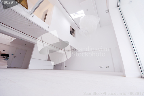 Image of Interior of empty stylish modern open space two level apartment