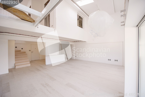 Image of Interior of empty stylish modern open space two level apartment