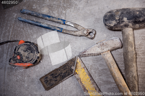 Image of set of hand working tools on concrete background