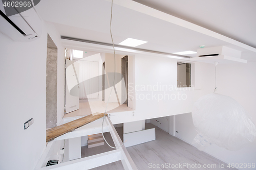 Image of Interior of empty stylish modern open space two level apartment