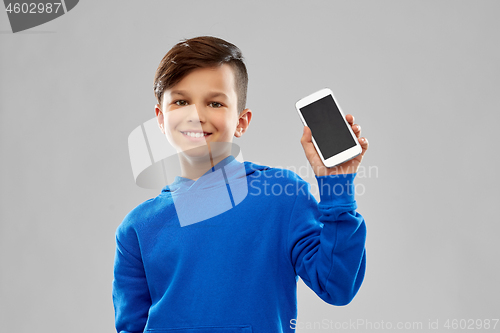 Image of smiling boy in blue hoodie showing smartphone