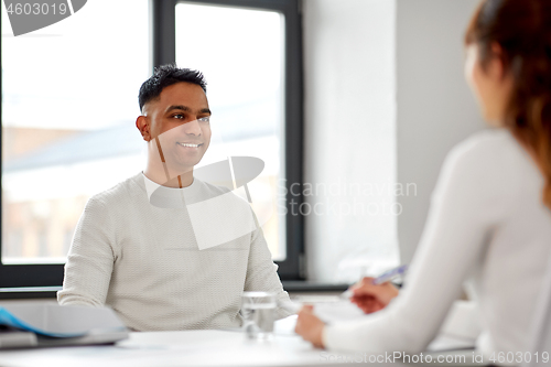 Image of employee having interview with employer at office