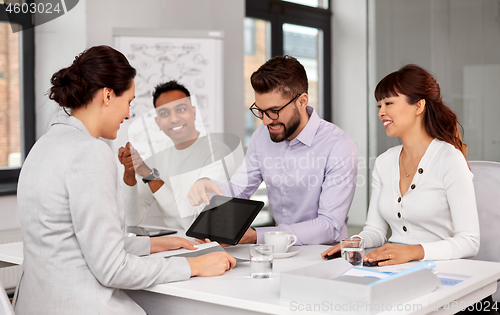 Image of team of recruiters with tablet pc at job interview