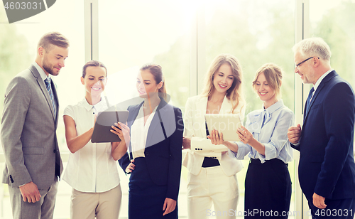 Image of business people with tablet pc computers at office