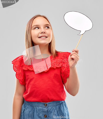 Image of smiling girl in red holding blank speech bubble