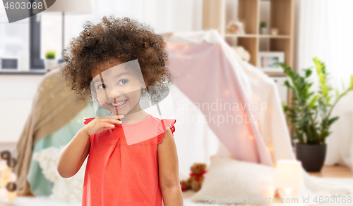 Image of happy little african american girl at home