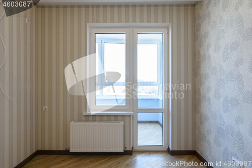 Image of Exit to the balcony in the interior with plastic windows without furniture