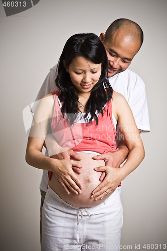 Image of Pregnant asian couple baby