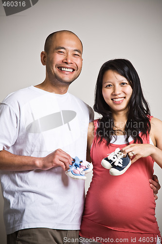 Image of Happy expecting asian couple