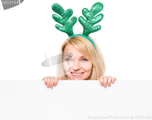 Image of Christmas woman showing board