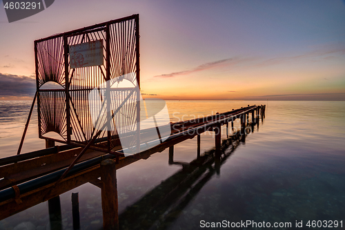 Image of Overpass with pipes going out to sea at sunset