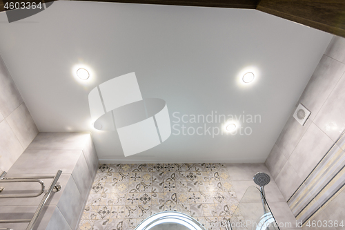 Image of Stretched ceiling in a modern bathroom after renovation