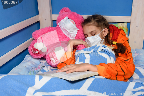 Image of Sick girl in medical mask fell asleep in bed