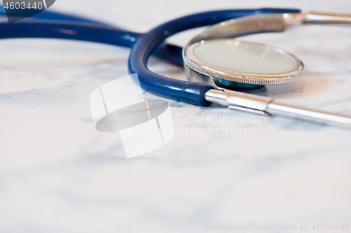 Image of Medical stethoscope or phonendoscope over light blue background