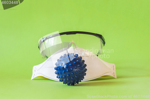 Image of Protecting mask and glasses on the table and microscope virus close up,. Coronavirus concept
