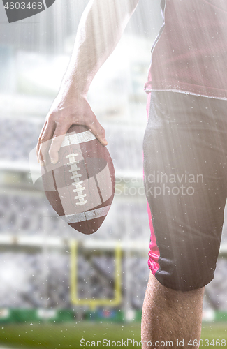 Image of closeup American Football Player isolated on big modern stadium