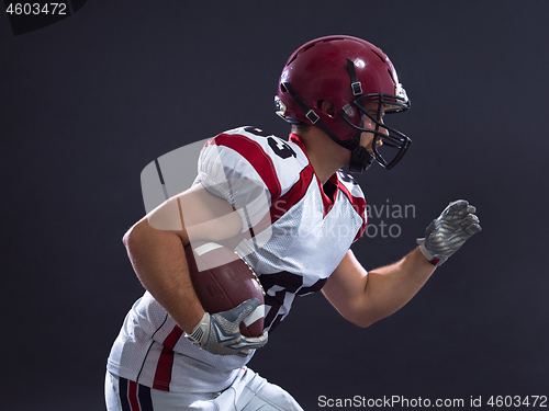 Image of American football Player running with the ball