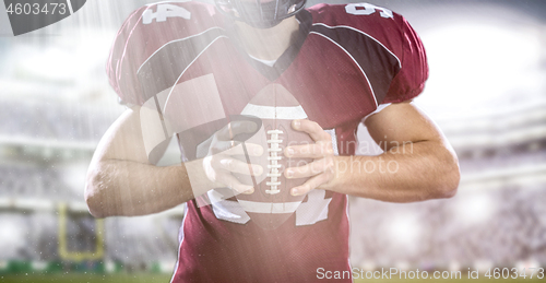 Image of closeup American Football Player isolated on big modern stadium