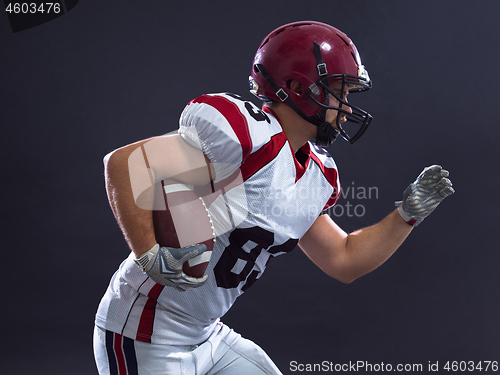 Image of American football Player running with the ball