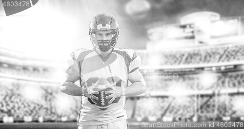 Image of American Football Player isolated on big modern stadium field