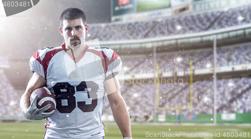 Image of American Football Player isolated on big modern stadium field