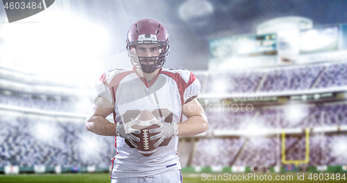 Image of American Football Player isolated on big modern stadium field