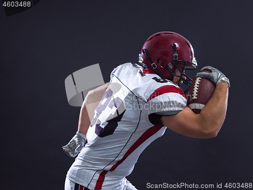 Image of American football Player running with the ball