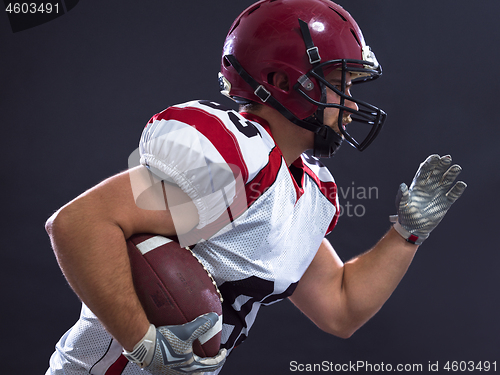 Image of American football Player running with the ball