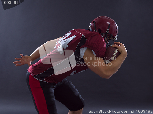 Image of American football Player running with the ball