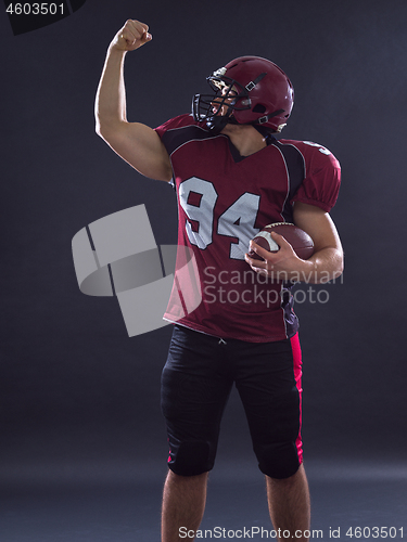 Image of american football player celebrating touchdown