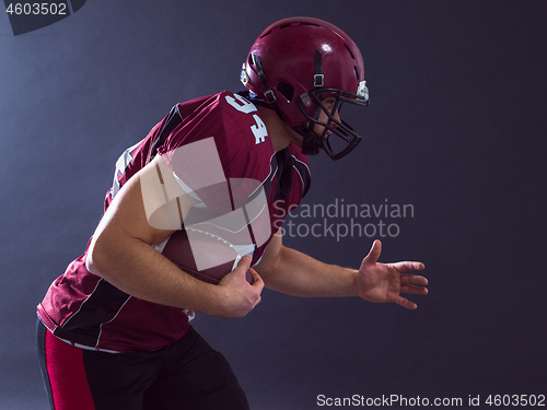 Image of American football Player running with the ball