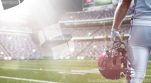 Image of closeup American Football Player isolated on big modern stadium