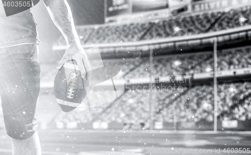 Image of closeup American Football Player isolated on big modern stadium