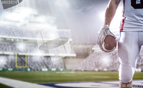 Image of closeup American Football Player isolated on big modern stadium