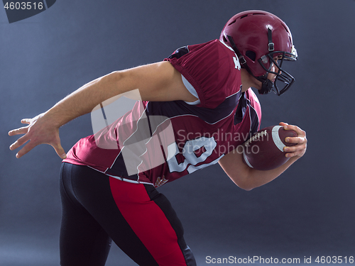 Image of American football Player running with the ball