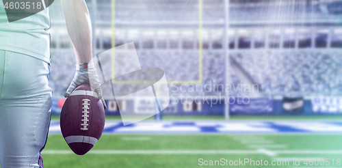 Image of closeup American Football Player isolated on big modern stadium