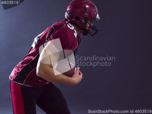 Image of American football Player running with the ball