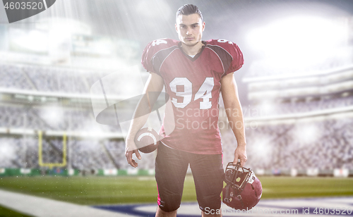 Image of American Football Player isolated on big modern stadium field