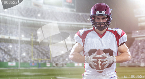 Image of American Football Player isolated on big modern stadium field