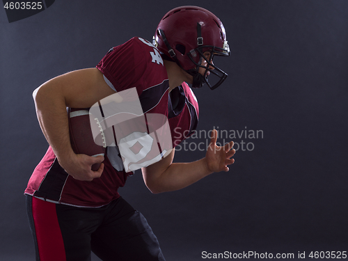 Image of American football Player running with the ball