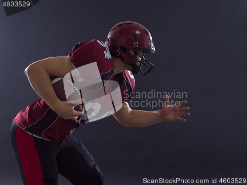 Image of American football Player running with the ball