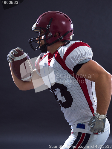 Image of American football Player running with the ball