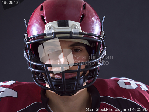 Image of closeup American Football Player isolated on gray